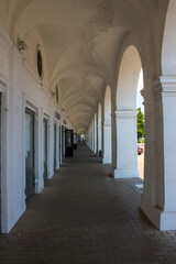 Old colonnade in the red rows of shopping malls in Kostroma Russia close up