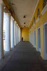 Old colonnade in the red rows of shopping malls in Kostroma Russia close up