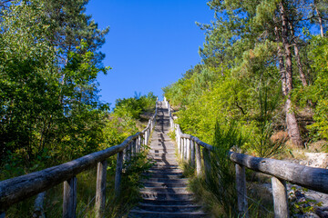 Wooden stairs on a hill