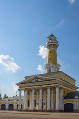 Fototapeta na wymiar Fire tower in the historical part of the Kostroma Russia on a clear summer day and space for copying