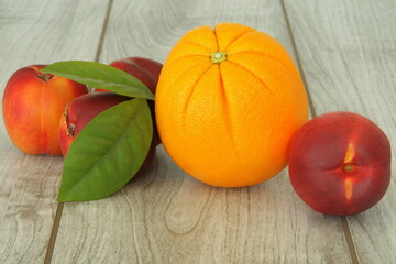A beautiful embossed pumpkin-like orange with peaches and leaves.