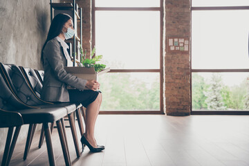 Full length profile side photo of serious girl lose job need new occupation sit chair card board...