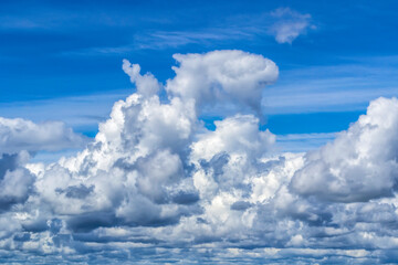 beautiful fluffy clouds in the blue sky