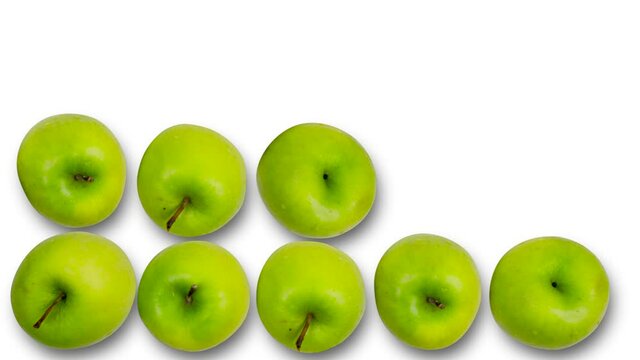 Organic apples making rows on white background