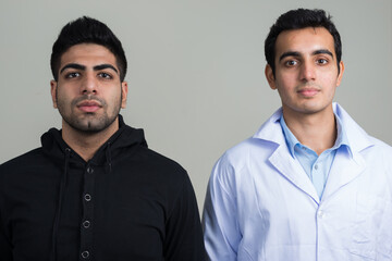 Portrait of two young Indian men as doctor and patient together