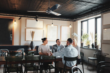 Smiling businesspeople having coffee