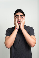 Portrait of young handsome bearded Indian man