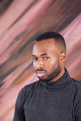 Fototapeta premium Handsome Black man looking Pensive in a grey shirt