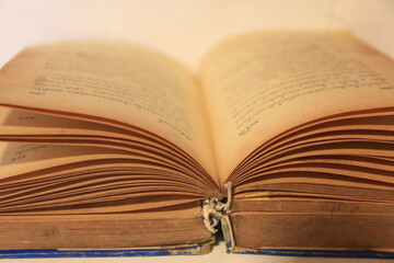 A close up of old books opened selective focus and shallow depth of field