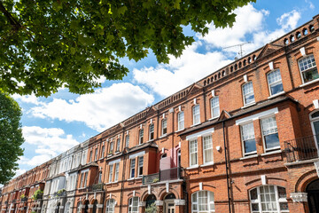 Fototapeta na wymiar Beautiful terrace of red brick residential property in Kensington, London 