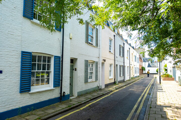Fototapeta na wymiar Attractive residential street of large terraced houses in Kensington & Chelsea borough of London 
