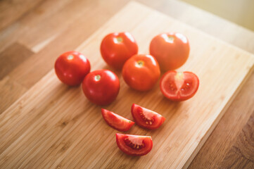Fresh ripe garden tomatoes on wooden table. 