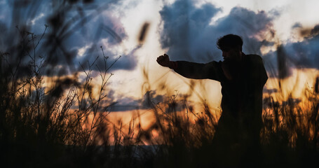 Man doing kungfu among the vegetation