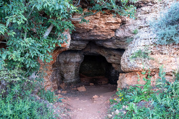Old cave entrance in the forest