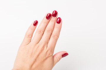 Stylish trendy female manicure. red manicure nails on white background