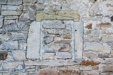 A closeup shot of an antique stone wall