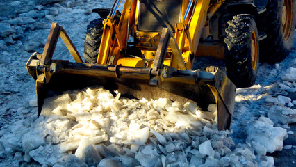 cleaning te street road from ice in winter