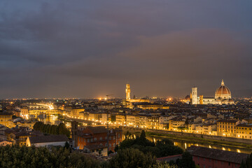 Fototapeta na wymiar Florence old city skyline at night with Ponte Vecchio over Arno River and Cathedral of Santa Maria del Fiore in Florence, Tuscany, Italy.