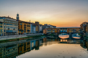 Sunrise at Ponte Vecchio bridge over Arno river in Florence, Italy.