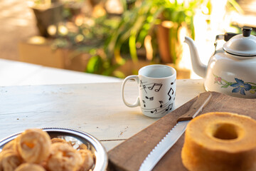 Cafe table with breads, crackers and accessories with blurred background, natural light on white table, selective focus