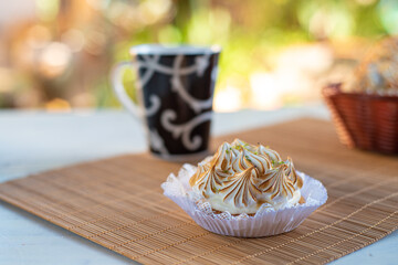 lemon pie and accessories with blurred background, natural light on white table, selective focus