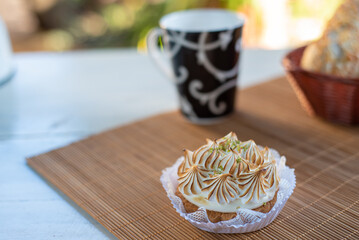 lemon pie and accessories with blurred background, natural light on white table, selective focus