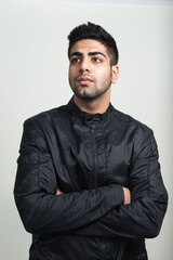 Portrait of young handsome bearded Indian man