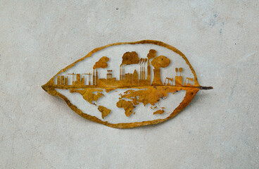 The city building cutting dry leaf. The city and industrial factory growth on the earth. Industrail toxic smoke destroys the environment. Save the earth green natural ecology.