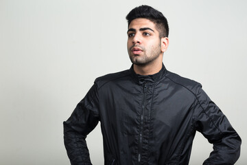 Obraz premium Portrait of young handsome bearded Indian man