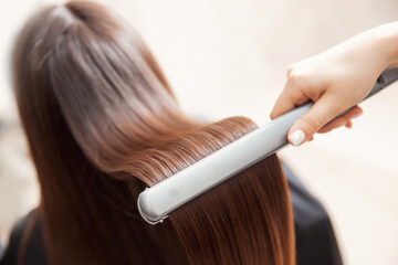 Keratin recovery hair professional and protein treatment pile with iron tool in salon stylist