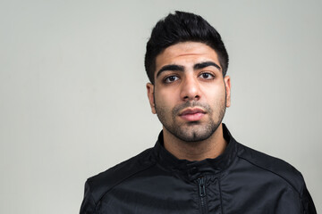 Obraz premium Portrait of young handsome bearded Indian man