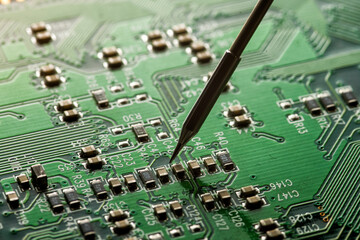 Soldering close up of electronic circuit board