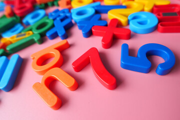 colorful plastic letters on pink background, Close up 