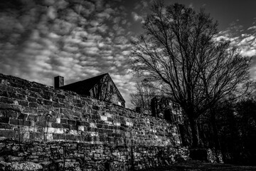 brick wall with dramatic sky black and white