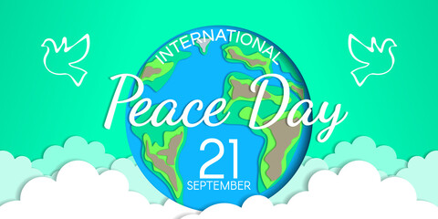 Fototapeta na wymiar international peace day web banner design with planet earth doves and clouds paper cut vector illustration