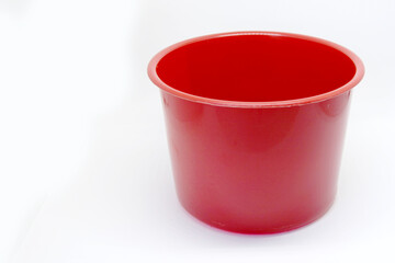 A red plastic pot for utilities, without logo