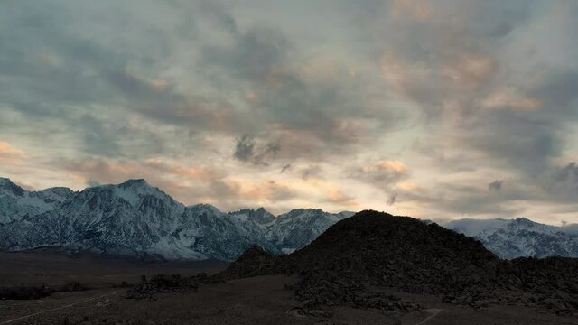 Cinematic aerial flyover of rugged rock formation at Alabama Hills in Eastern Sierra in California
