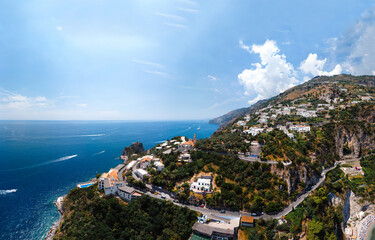 Naklejka premium Aerial view of Conca dei Marini,Tovere. Beautiful bay and famous resort near Amalfi, Curve road and hotels. Italy, Europe