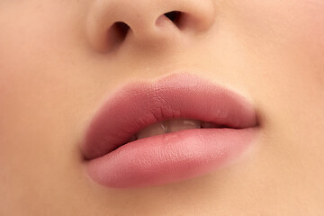 Close-up of Beautiful lips. Part of the face, the young woman is close. Sexy plump lips. close up.