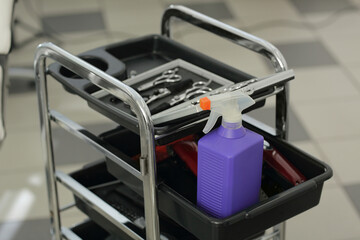 barber's supplies in a Hair Salon Trolley with a bottle of antiseptic