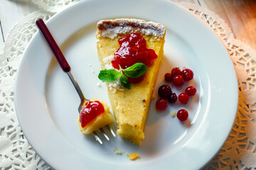 Halloween pumpking cake with cranberry cream on a plate. Food photography