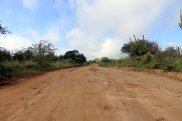 rain in ccatinga - wet clay road after heavy rains