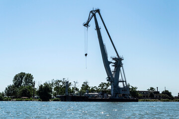 Fototapeta premium Ship crane on Sulina branch. The Danube Delta, the second largest river delta in Europe. Romania.