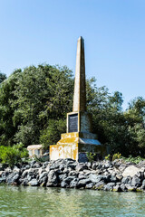 The obelisk in honor of king Carol I, Crisan village, Sulina branch. The Danube Delta, the second largest river delta in Europe. Romania.