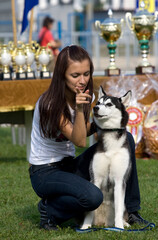 Happy owner with her siberian husky dog