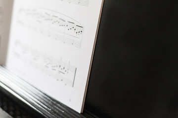 Music book on the music stand of a grand piano pianist concert nervousness musical instrument...