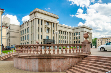 Fototapeta premium Central House of Officers of the Armed Forces or Army Palace building on October Square in Minsk city historical centre, blue sky white clouds in sunny summer day, Republic of Belarus