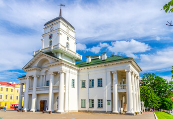 Obraz premium Town Hall building on Freedom Svabody square in Upper Town Minsk historical city centre, blue sky white clouds in sunny summer day, Republic of Belarus