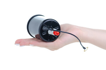 Naklejka premium Fine fuel pump filter in hand on white background isolation