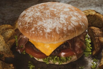 Tasty burger on rustic background
